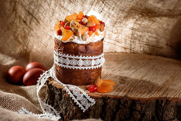 Traditional Slavic pies with orange, candied fruit, raisins and cinnamon on a wooden board on a...