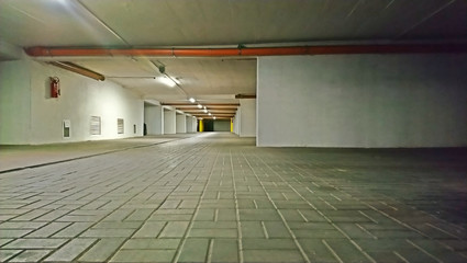 Underground garage, parking spaces in the garage under the apartment building
