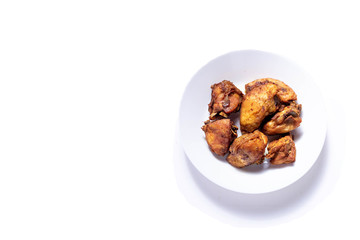Fried Chicken on a plate with isolated white shot