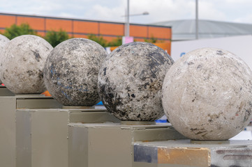 Atlas Stones on their podiums at a Strongman Contest