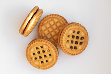 sandwich cookies with cocoa creme on white background