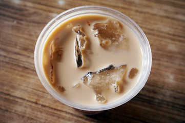 Cappuccino Coffee Ice in plastic cup. 
