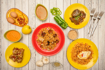 yellow and red plates with Spanish food and sauces