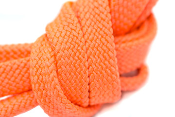 Orange shoelaces, macro, isolated on a white background