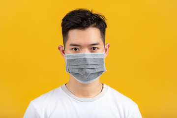 Portrait of a man wearing a medical mask. Taking care of yourself during an epidemic. Prevention of infection concept.