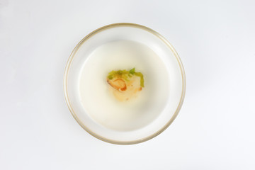Plain chicken broth soup kuah sup served as gravy in glass bowl