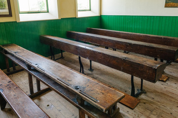 Benches in an old fashioned schoolroom