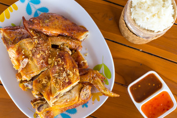 Delicious Thai style grilled chicken drumstick with spicy sauce