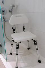 Chair for use by disabled people in an accessible shower