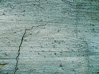 
Crack in the wall of the building. Blurred defocused background for web design.