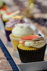 Cupcakes lined up on a market stall