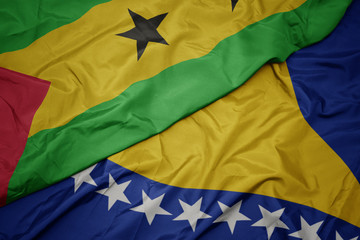 waving colorful flag of bosnia and herzegovina and national flag of sao tome and principe .