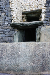 Spiral carvings on a kerb stone at the entrance to Newgrange chambered passage tomb