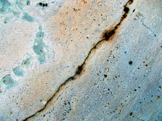 
Crack in the wall of the building. Blurred defocused background for web design.