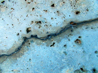 
Crack in the wall of the building. Blurred defocused background for web design.