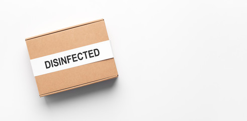 Delivery box disinfected from coronavirus on white