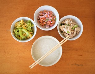 rice soup with fried vegetable ,shrimp salad and garlic chicken 