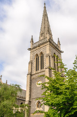 Fototapeta na wymiar Church of England spire and bell tower