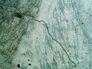 
Crack in the wall of the building. Blurred defocused background for web design.