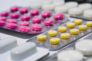 Many colorful tablets in a blister pack. The concept of the pharmaceutical industry. Pharmacy-Pharmacy.