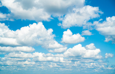 Blue sky with fluffy clouds in summer, cloudscape.