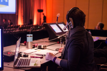 Woman working at mixing desk