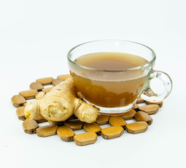 hot ginger tea with ginger root isolated on white background