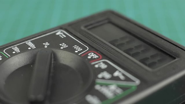Electronic multimeter tool power on. And measuring voltage test. Close up