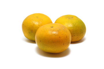 Three sweet oranges (Citrus sinensis) isolated on white background, perfect for breakfasting during ramadan