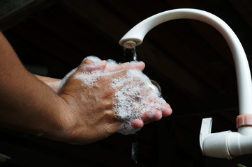 Coronavirus pandemic prevention wash hands with soap and water.