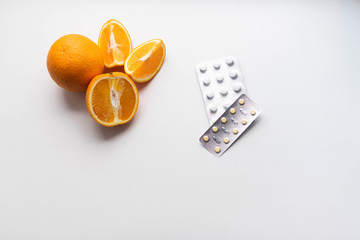 oranges and vitamins tablets pills