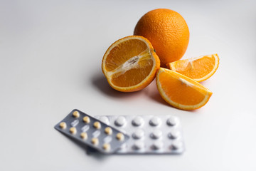 oranges and vitamins tablets pills