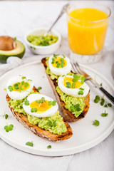 Avocado Sandwich with Egg and Micro green. Healthy breakfast concept
