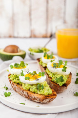 Avocado Sandwich with Egg and Micro green. Healthy breakfast concept