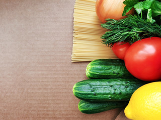 set of food. fresh greens. Tomatoes cucumbers. lemon. paste. concept donation box.