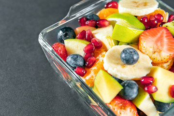 Portion fruit salad in a bowl . Healthy meal