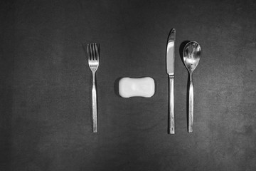 fork and spoonon a black table