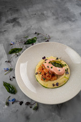 Latino american main course mofongo with shrimps and broth close-up on a plate on the table. horizontal top view from above