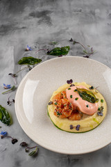 Latino american main course mofongo with shrimps and broth close-up on a plate on the table. horizontal top view from above