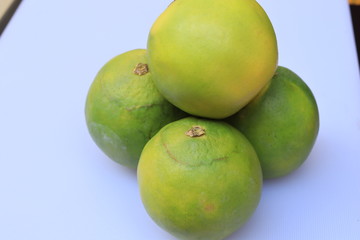 Yellow and green color whole ripe Sweet lime fruits or Citrus limetta