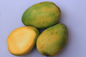 Fresh Yellow Mango fruit slice isolated on white background

