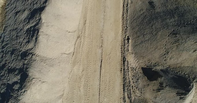 Top down aerial footage of a pile of sandy aggregate