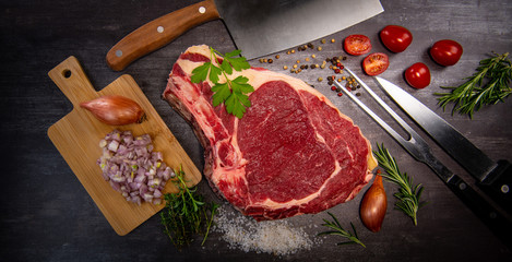 Raw T Bone steak entrecote prepared to Grill on turntable