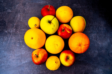 Several fruits and citruses arranged in circle