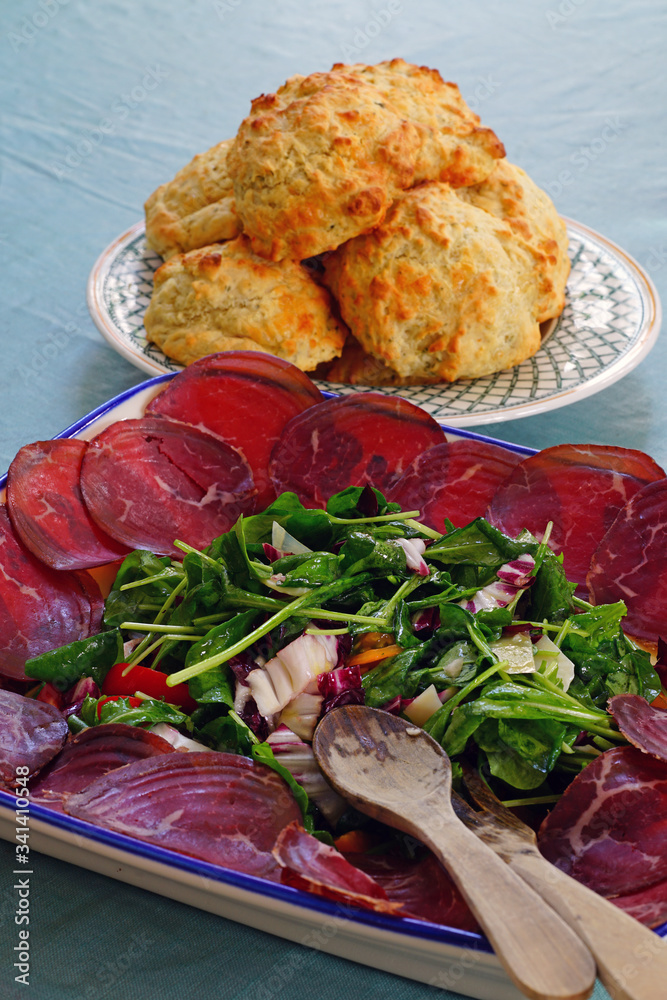 Wall mural an arugula and radicchio salad with slices of bresaola, italian dried beef