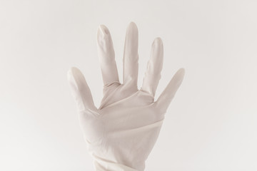 Female doctor's hand on a light background.
