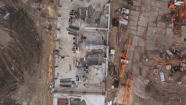 Construction site of a residential complex aerial view. Videography with a drone. Span over the construction site.