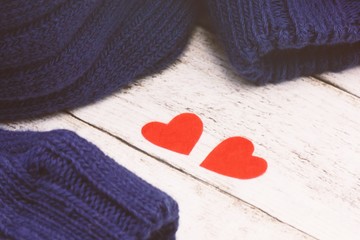 Valentines day concept. Two red hearts and knitted sweater