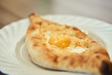 Khachapuri closeup with the egg, the Georgian cuisine. Street food. - 341413332