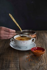 Red Lentil Soup with ingredients on wooden background, top view, copy space. Traditional turkish or arabic lentil and vegetable spicy soup, healthy vegan food.
